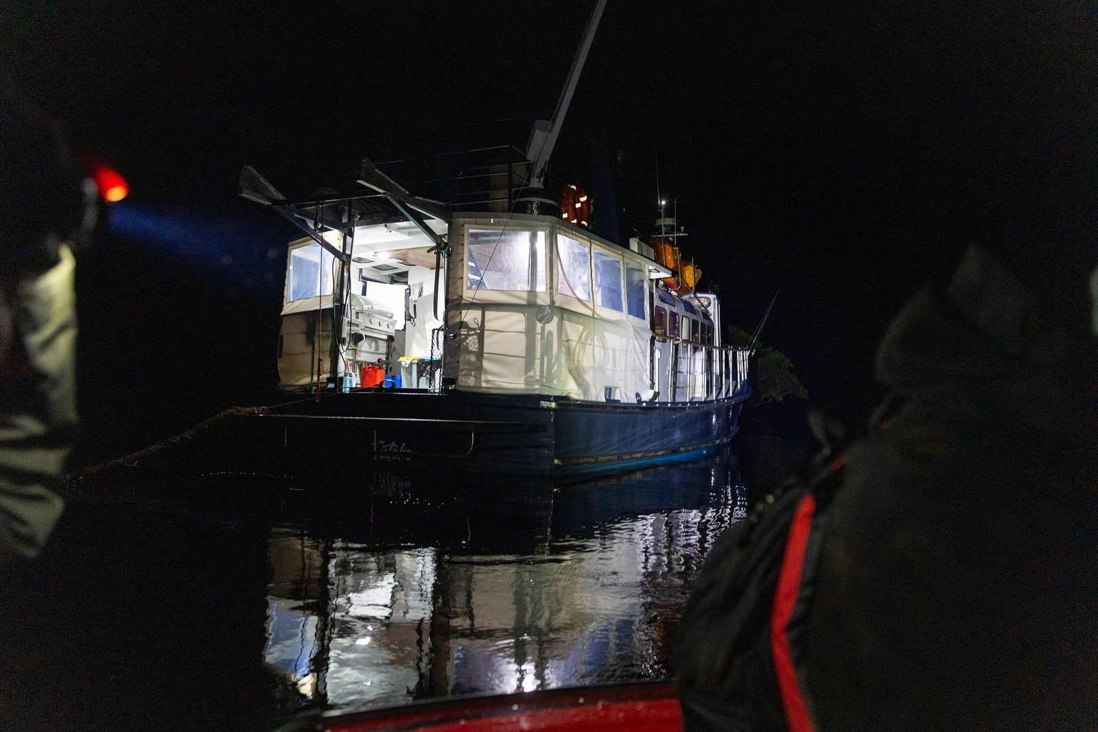 MV Tutoko lit up at a night anchorage in Doubtful Sound